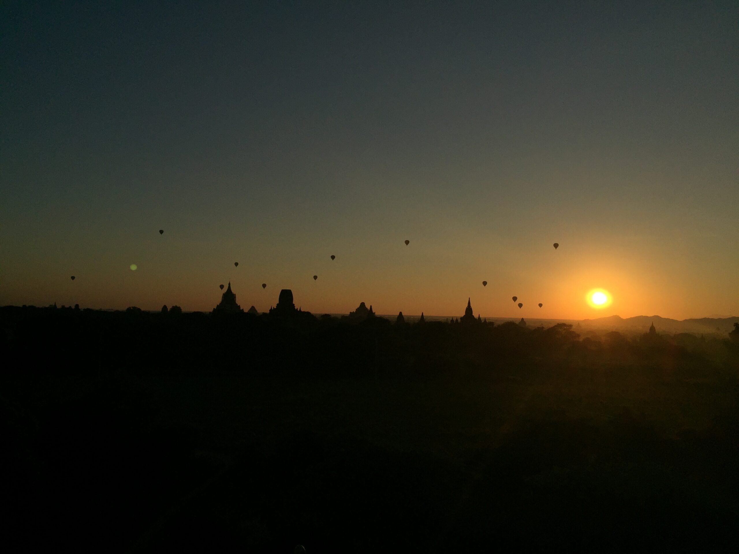 Hot air balloons during sunrise in Myanmar.