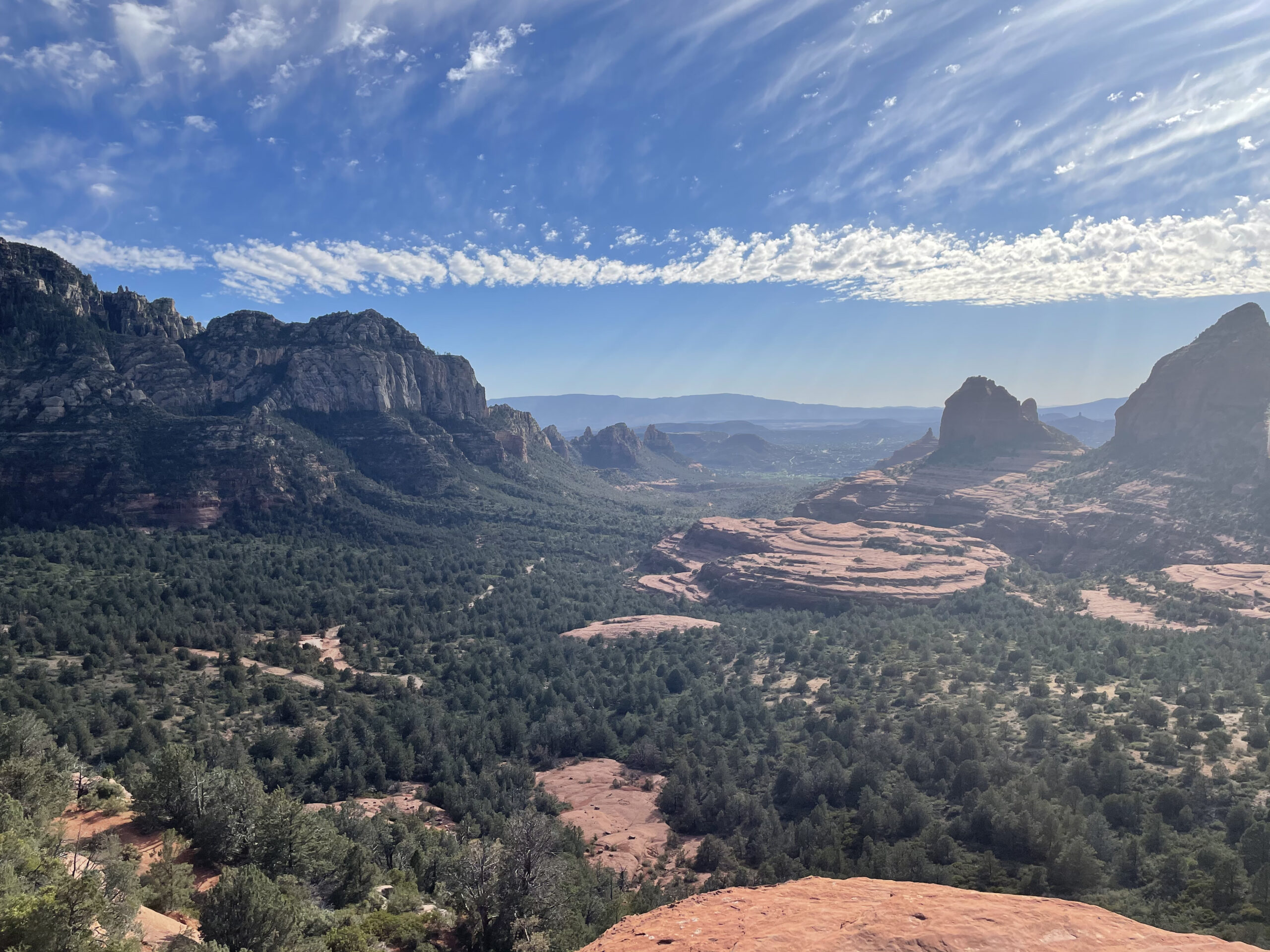 view of rock formations an blue sky while hiking in Sedona